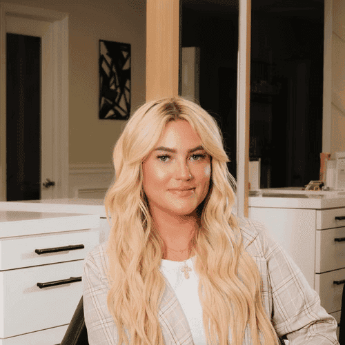 Portrait of Lindsay, a professional stylist at The Beauty Vault Hair Salon, showcasing their expertise and style.