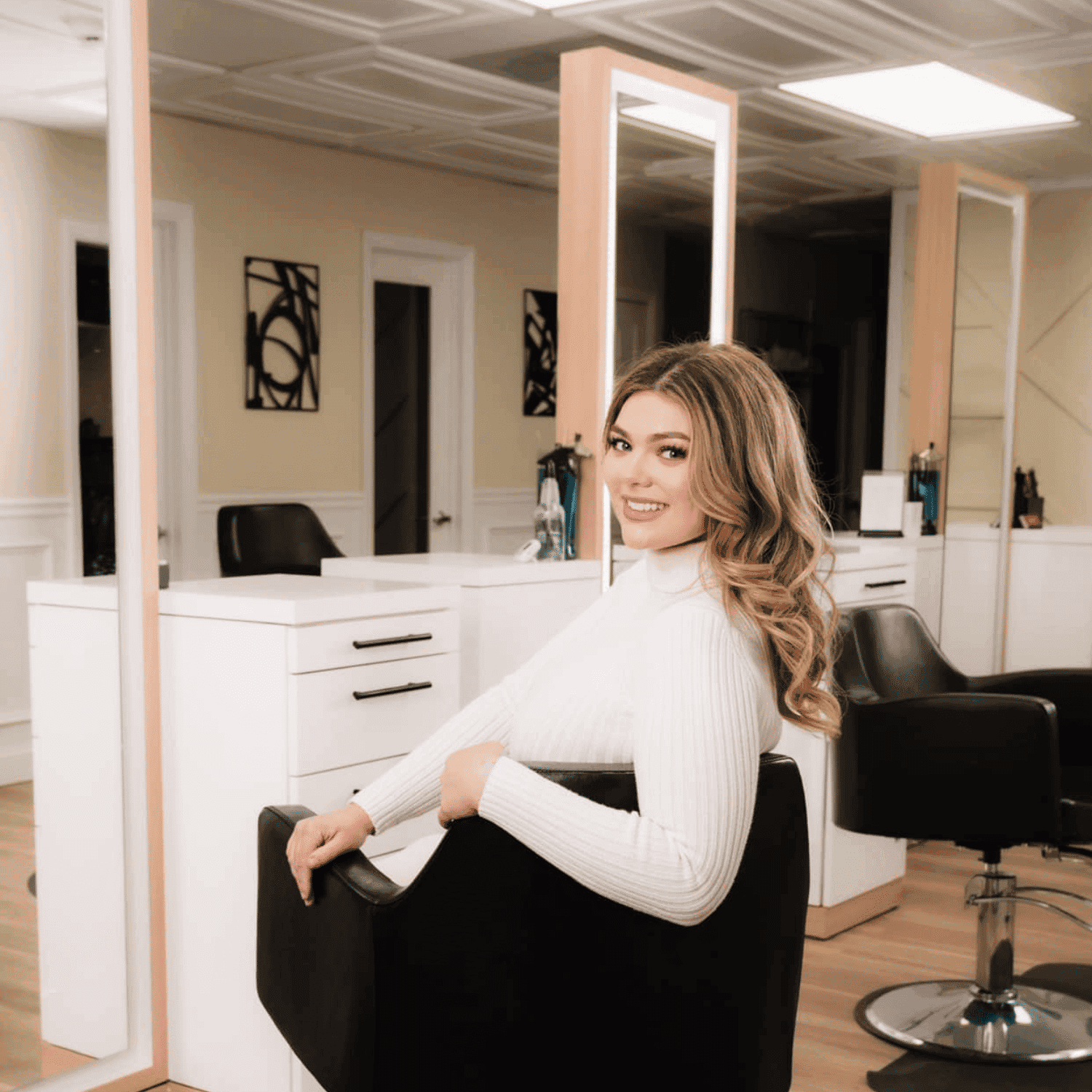 Portrait of Casey, a professional stylist at The Beauty Vault Hair Salon, showcasing their expertise and style.