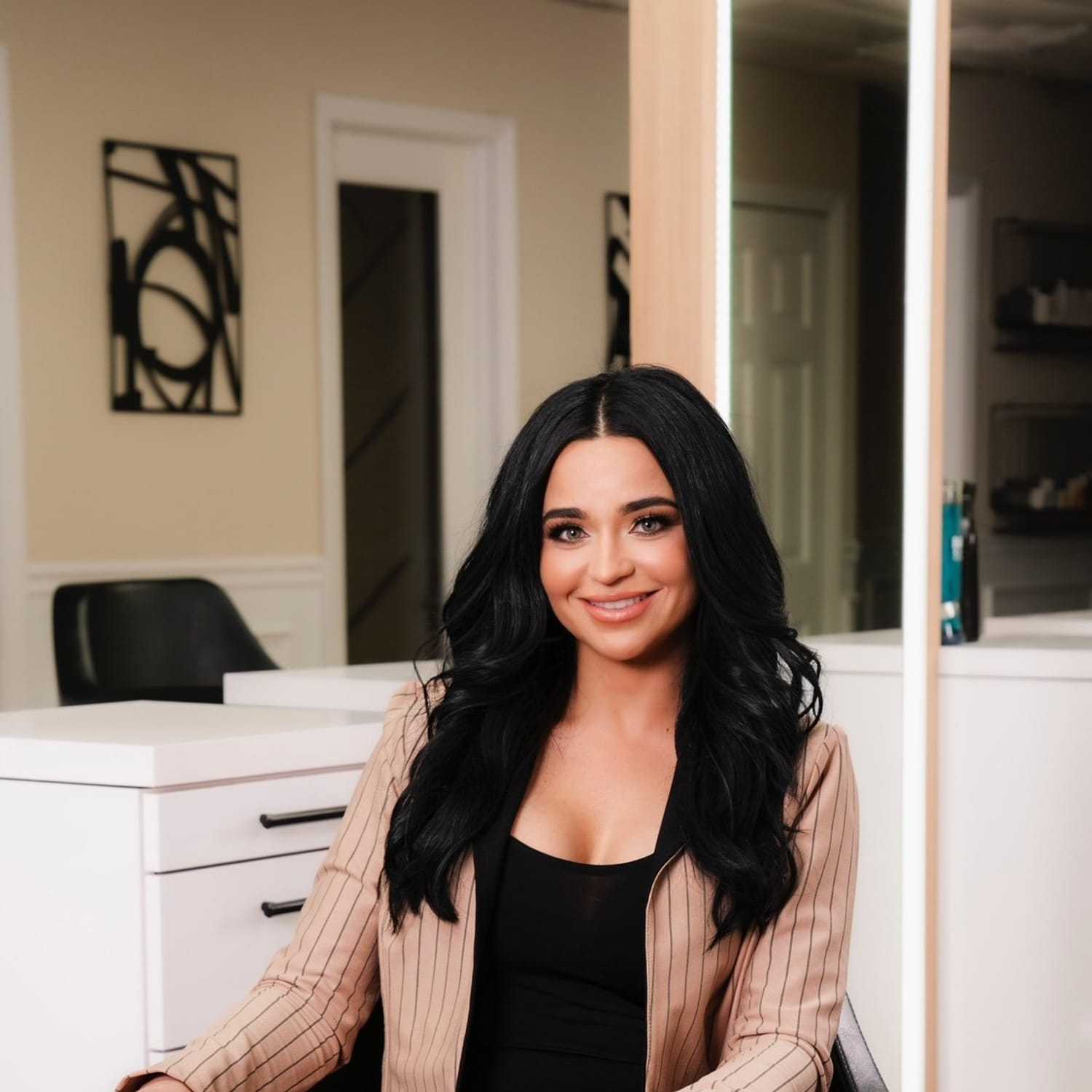 Portrait of Kiersten, a professional stylist at The Beauty Vault Hair Salon, showcasing their expertise and style.